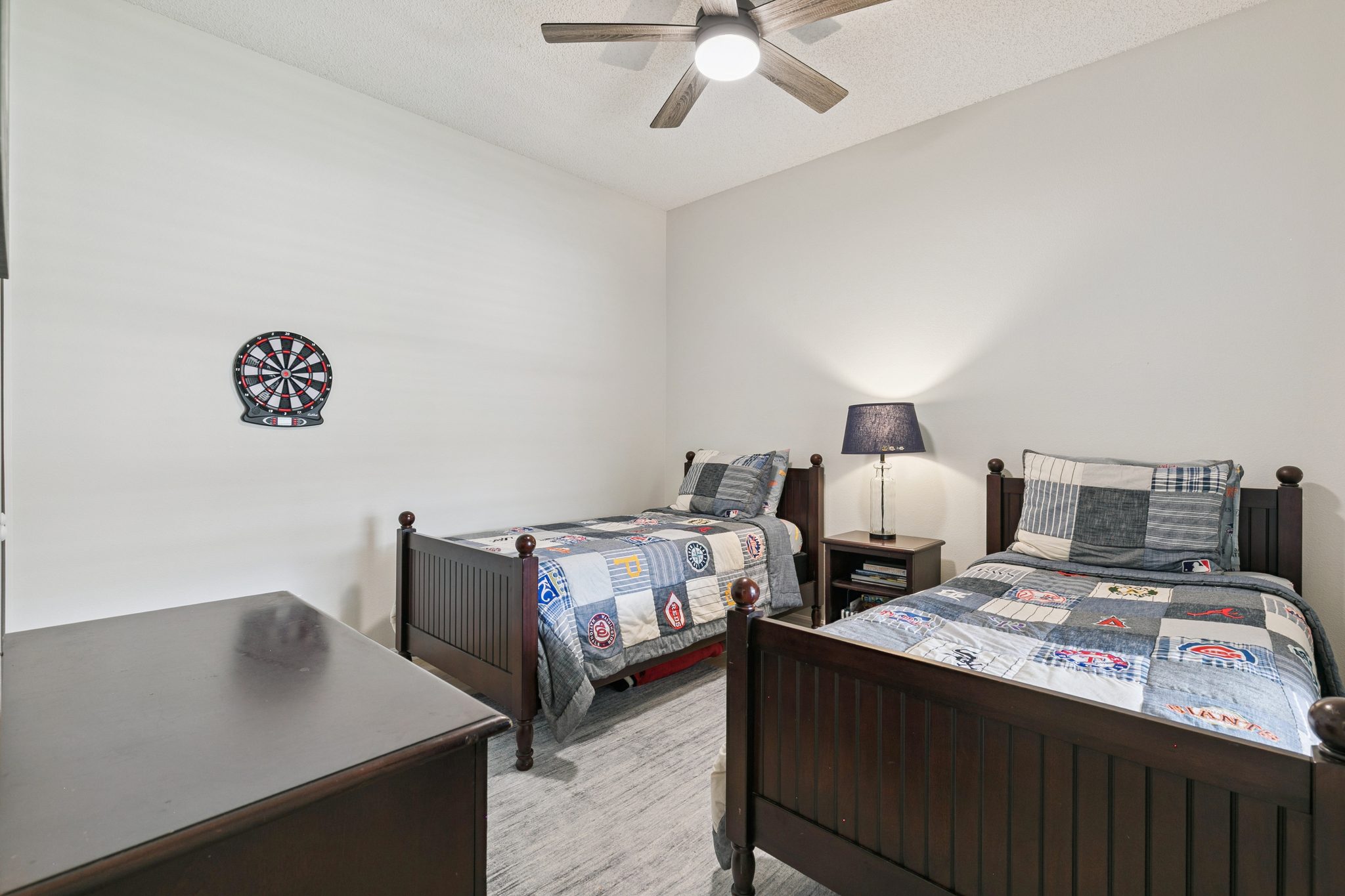 Second bedroom, comfortably furnished with a window and closet at 13449 Carroway St, Windermere