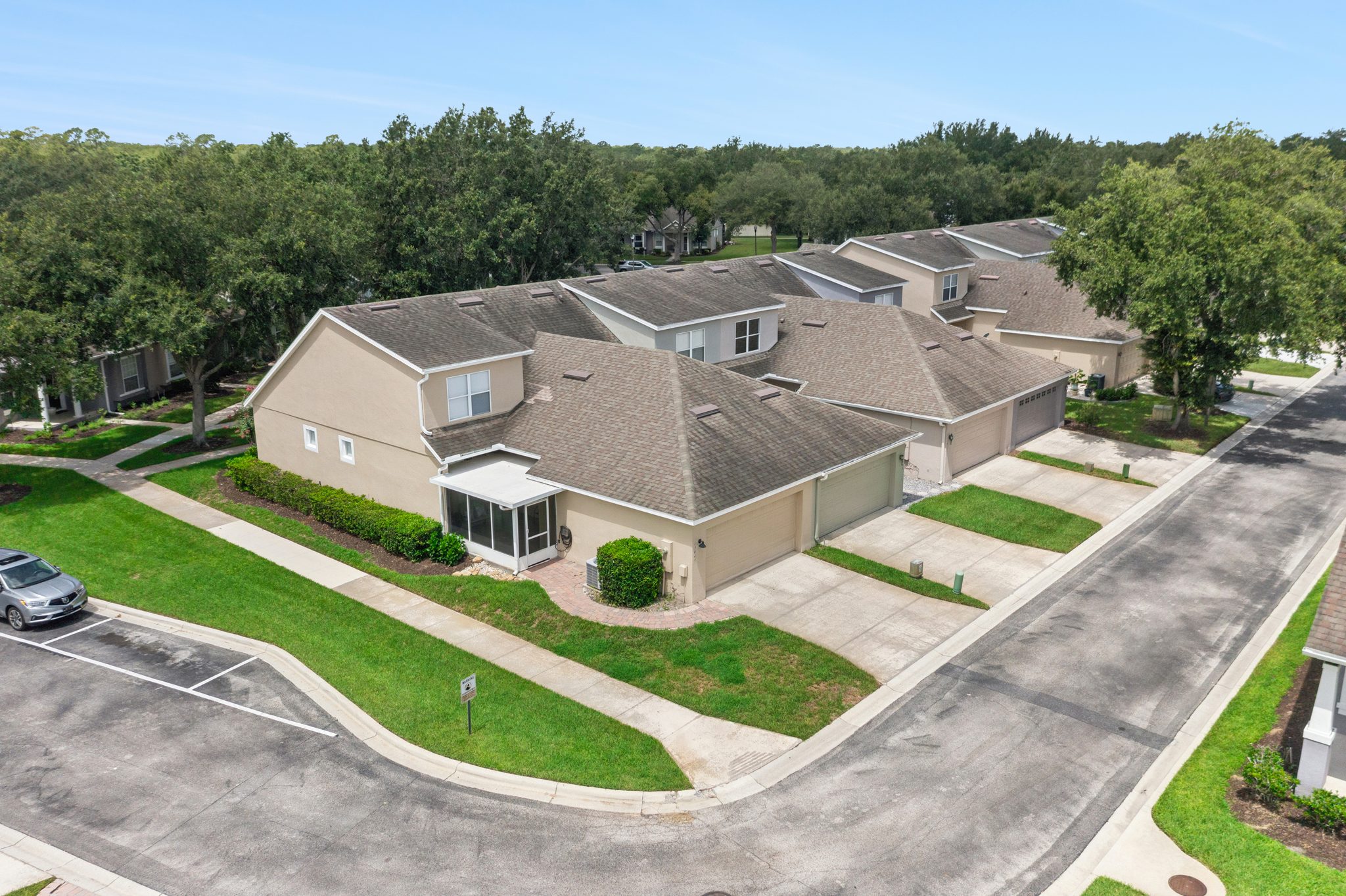 Aerial view of the townhome and its low-maintenance streetscape at 13449 Carroway St, Windermere